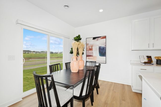 (Photo of decorated model, actual home's finishes will vary) The spacious and open-concept main level allows for optimal versatility and comfort. | Image 7