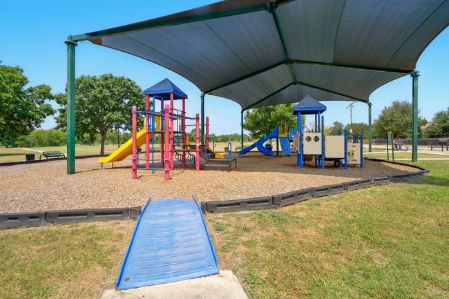 Community jungle gym featuring a lawn | Image 23