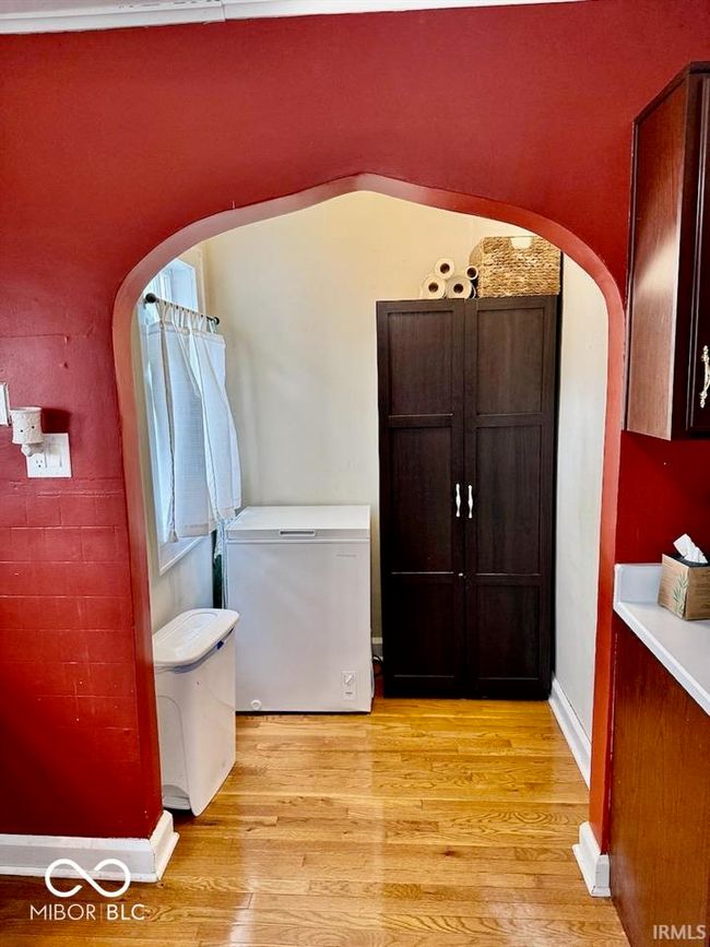 bathroom featuring wood finished floors and baseboards | Image 24