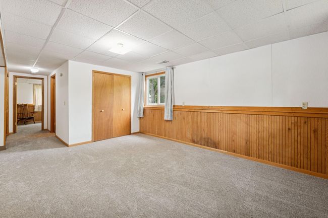 Downstairs, you'll find a large space that could be used as a family room, plus flex space for a wide variety of purposes. | Image 17