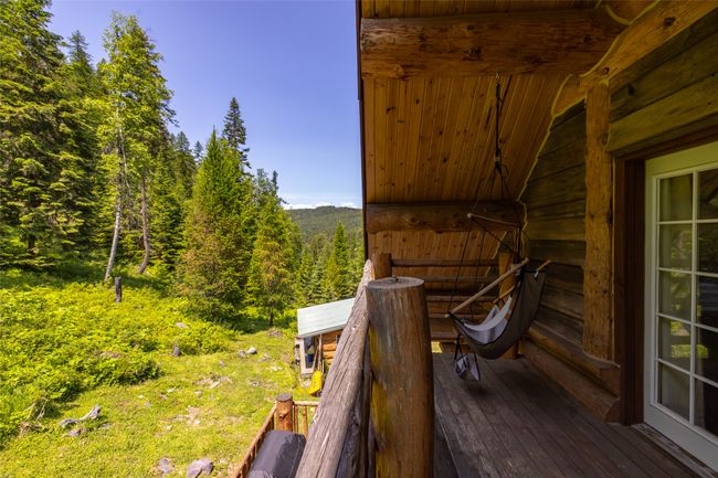 Wooden terrace featuring a view of trees | Image 109