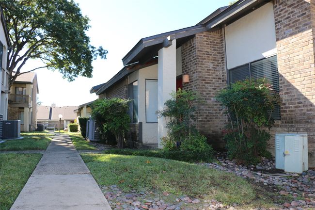 View of side of property featuring brick siding and stucco siding | Image 5