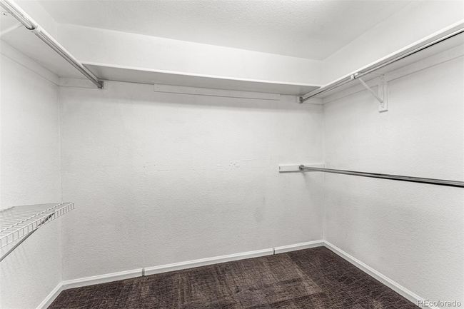 Second primary suite walk-in closet adjacent to the primary bath! | Image 25