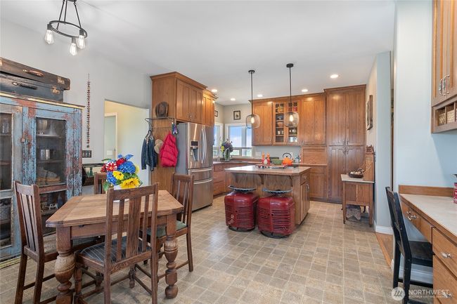 Kitchen area with seating | Image 12