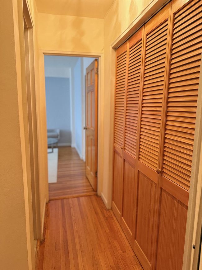Corridor featuring light wood-style flooring | Image 6