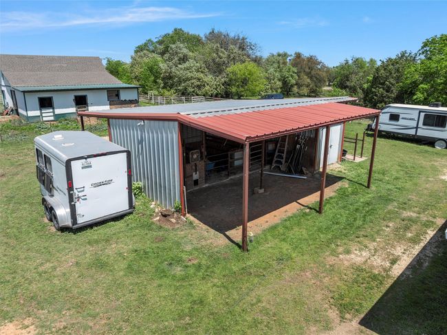 View of pole building featuring a yard | Image 34