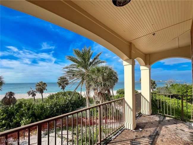 Balcony featuring a water view and a beach view | Image 41