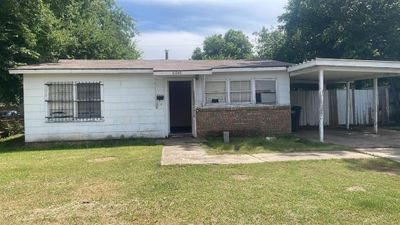 View of front of house with a front yard and a carport | Image 1