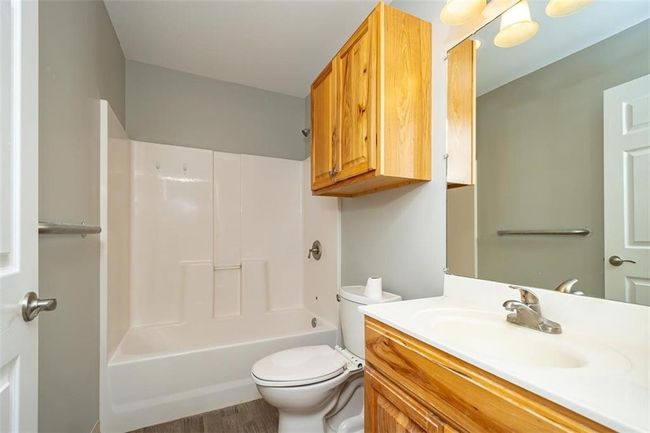 Bathroom with shower / bath combination, toilet, and vanity | Image 24