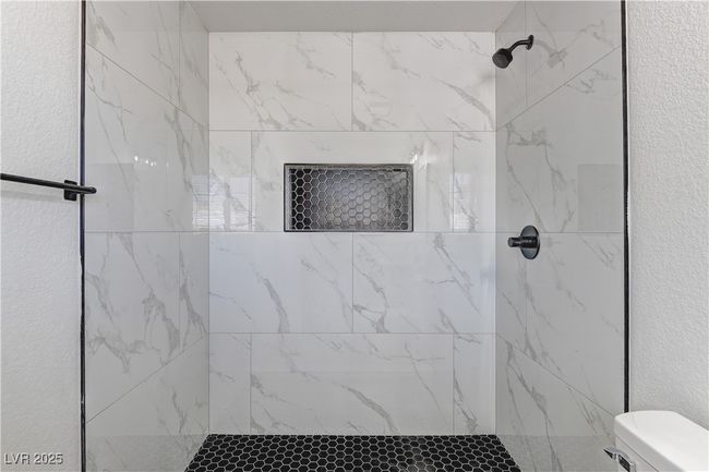 Full bathroom with a tile shower and toilet | Image 21