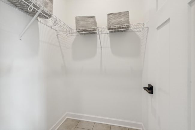 (Photo of a decorated model home, actual features may vary) A generously sized mudroom closet | Image 13