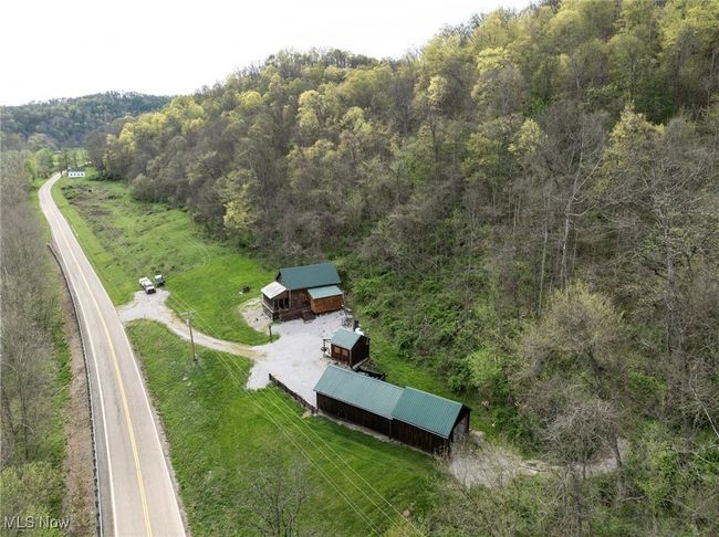 Aerial view featuring a wooded view | Image 30