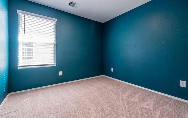 Carpeted spare room with baseboards | Image 19