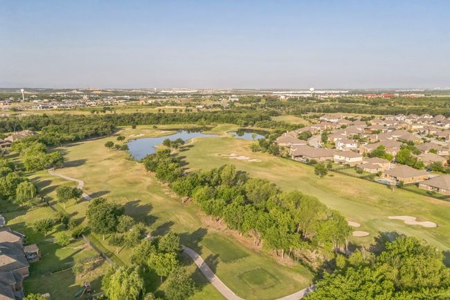Birds eye view of property with golf course view, a residential view, and a water view | Image 30