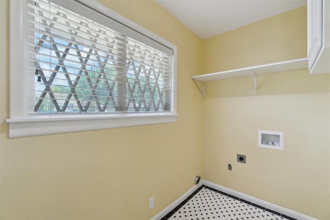 Laundry room featuring hookup for a washing machine and hookup for an electric dryer | Image 33