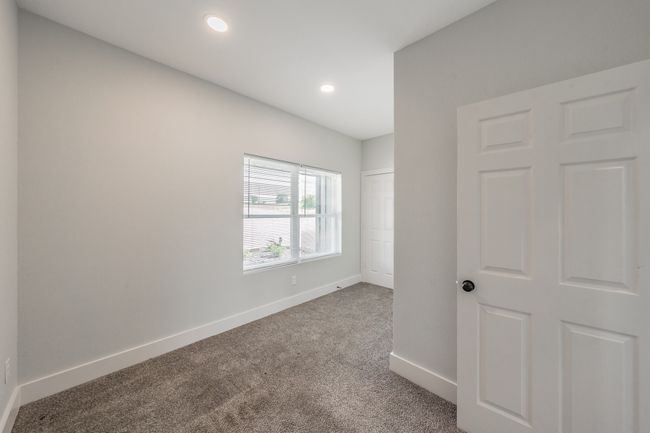 Unfurnished bedroom with carpet floors, baseboards, and recessed lighting | Image 26