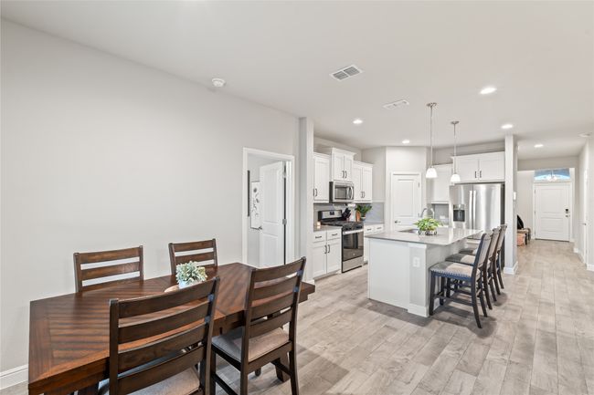 Dining room featuring recessed lighting, visible vents, light wood finished floors, and baseboards | Image 13