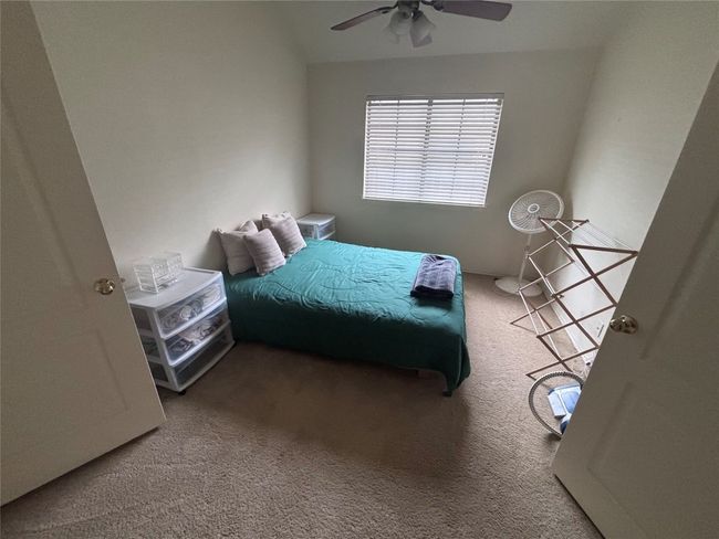 Bedroom featuring carpet floors and a ceiling fan | Image 9