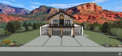 View of front of property featuring a garage, a balcony, a mountain view, and a front lawn | Image 1