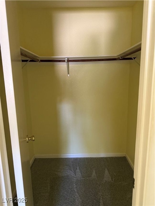 Spacious closet with carpet floors | Image 21