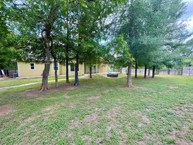 View of yard with fence | Image 24