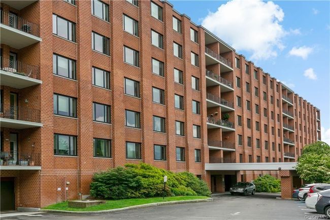 Building 1 Entrance. Unassigned exterior parking is free; Garage parking is $75/mo. | Image 23