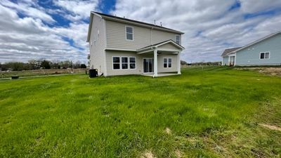 large level back yard, with great covered porch with fan | Image 3