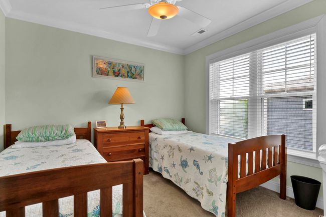 Bedroom featuring carpet flooring, ornamental molding, and ceiling fan | Image 23