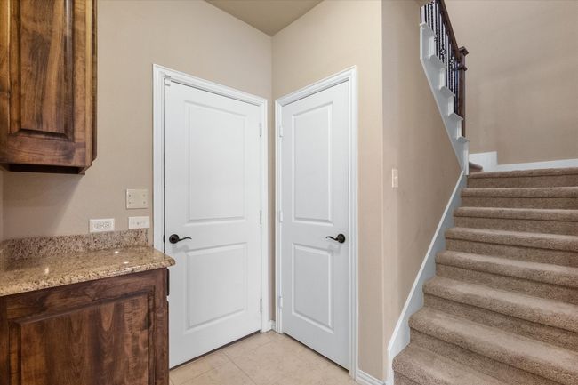 Staircase and entry area from garage | Image 31