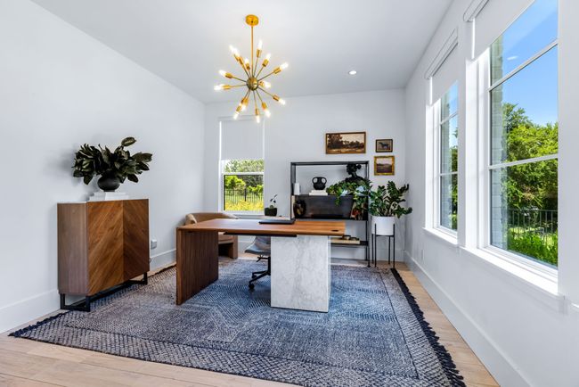 Office area featuring a chandelier, wood finished floors, and recessed lighting, lots of window for a light and bright working space. | Image 6