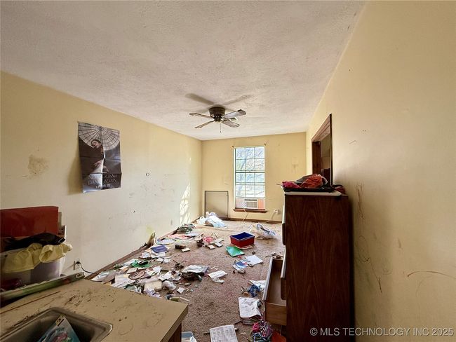 VIEW FROM THE PRIMARY BATHROOM TO THAT ROOM OFF BEDROOM #1 THAT COULD EASILY BE ANOTHER BEDROOM | Image 24