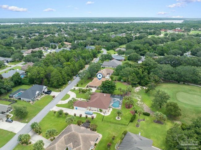 7008 Turnberry Cir, House other with 4 bedrooms, 2 bathrooms and 3 parking in Navarre FL | Image 63