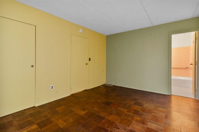 Bedroom featuring baseboards and bathroom | Image 22