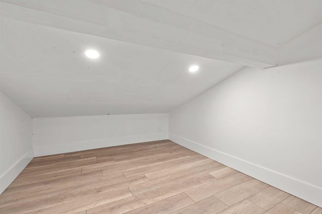Bonus room featuring recessed lighting, vaulted ceiling, baseboards, and light wood-type flooring | Image 21