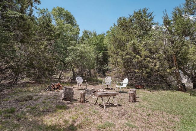 View of yard with a fire pit | Image 36