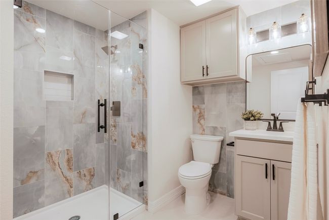Bathroom featuring vanity and a shower stall | Image 16