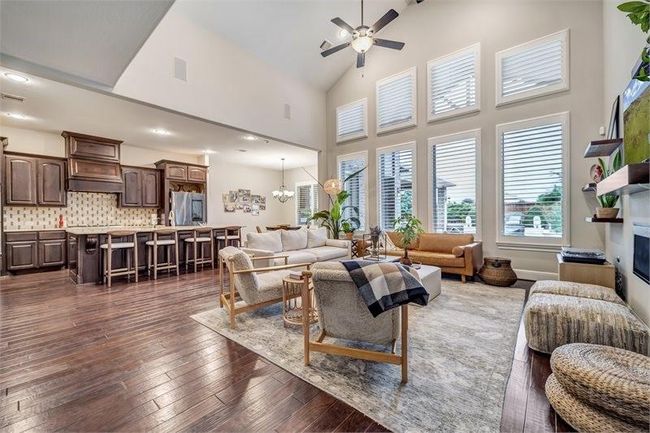 With high ceilings, this residence is illuminated by large windows. | Image 14