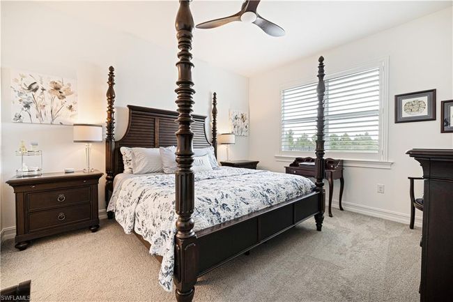 Bedroom with light carpet and ceiling fan | Image 18