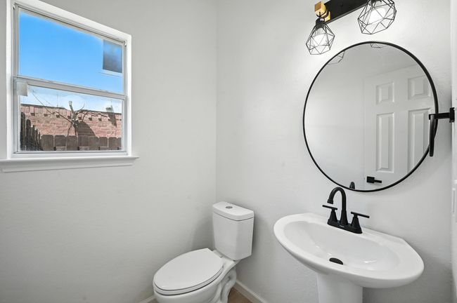 Bathroom with toilet and baseboards | Image 12