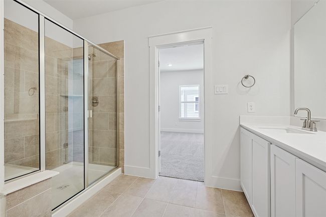 Bathroom with tile patterned floors, walk in shower, and vanity | Image 20