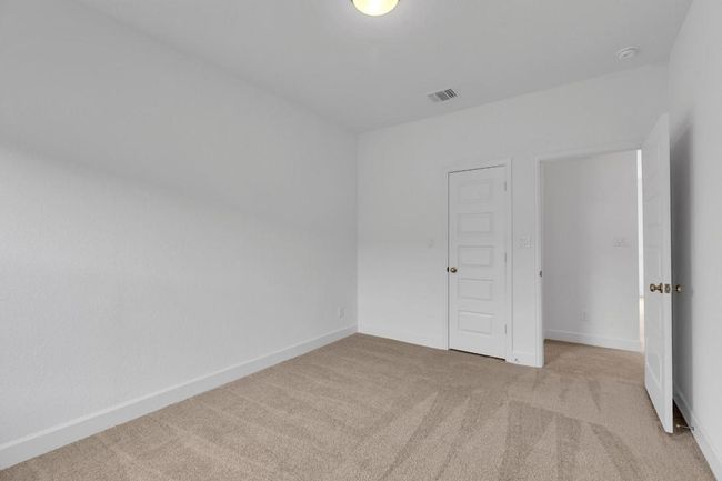 Carpeted empty room with baseboards | Image 37