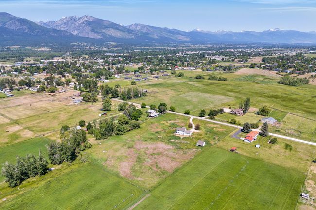Aerial overview of property's location featuring a mountain backdrop and rural landscape | Image 65
