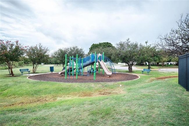 Community playground featuring a lawn | Image 22