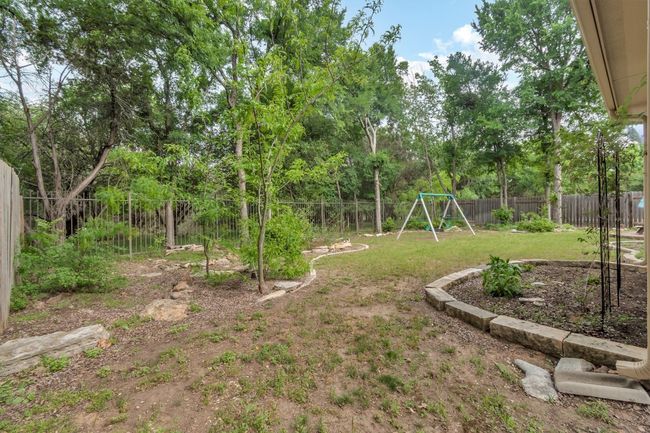 View of yard with a fenced backyard and a playground | Image 35