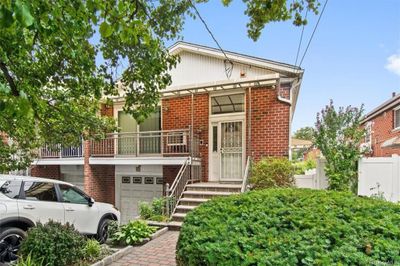 View of front of property with a garage | Image 1