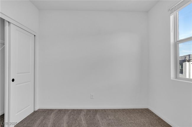 Unfurnished bedroom with a closet, carpet flooring, and baseboards | Image 20