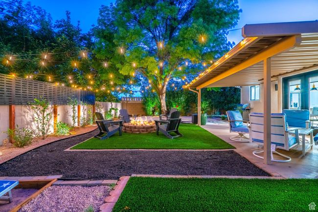 Yard at dusk with a patio area and a fire pit | Image 21
