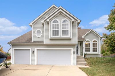 View of front facade featuring a garage | Image 1