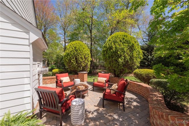 View of patio with an outdoor fire pit and fence | Image 39