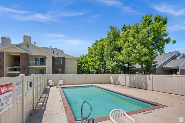 Community pool with a patio | Image 15